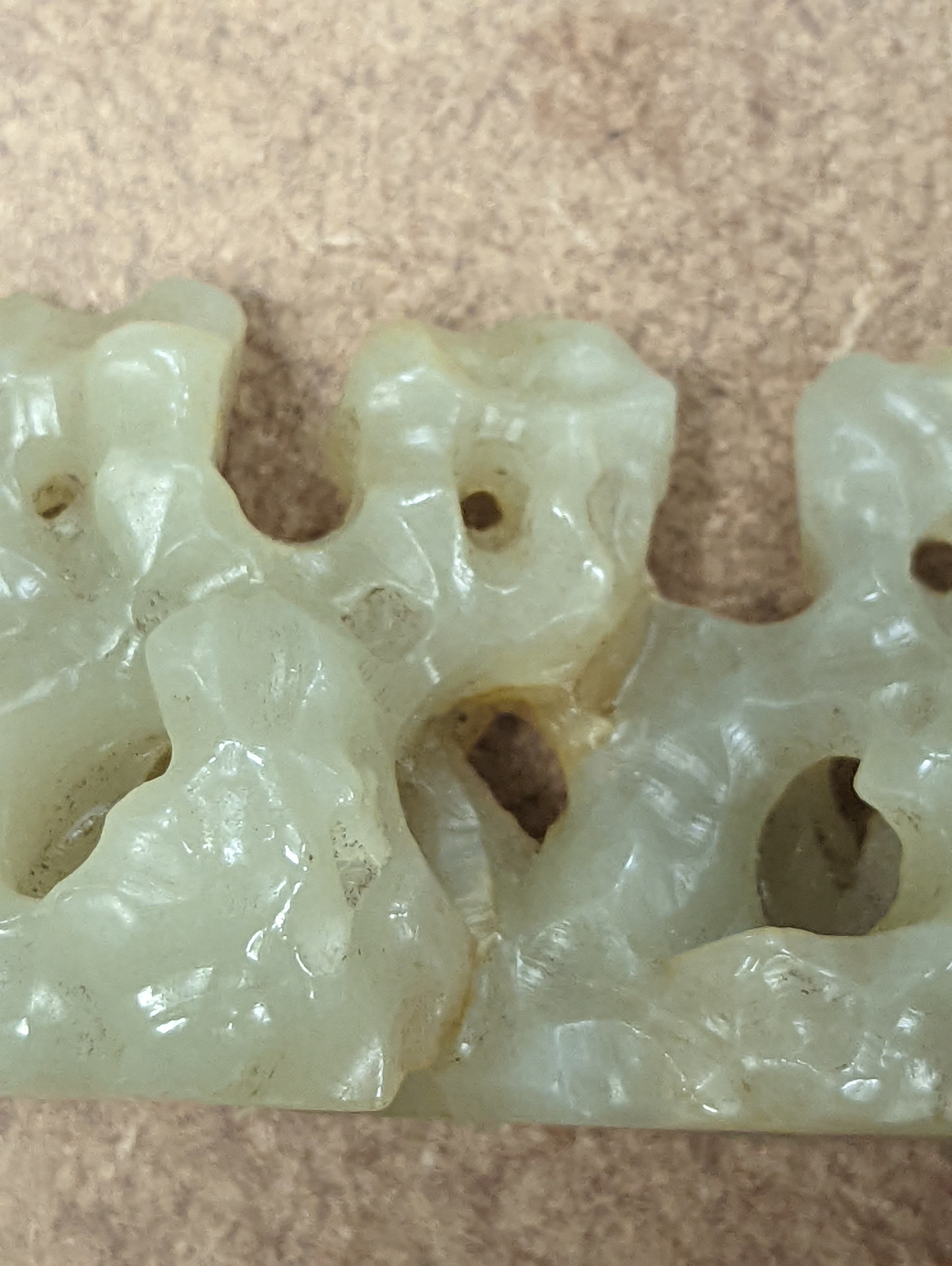 A Chinese celadon jade brush rest, 8cms wide